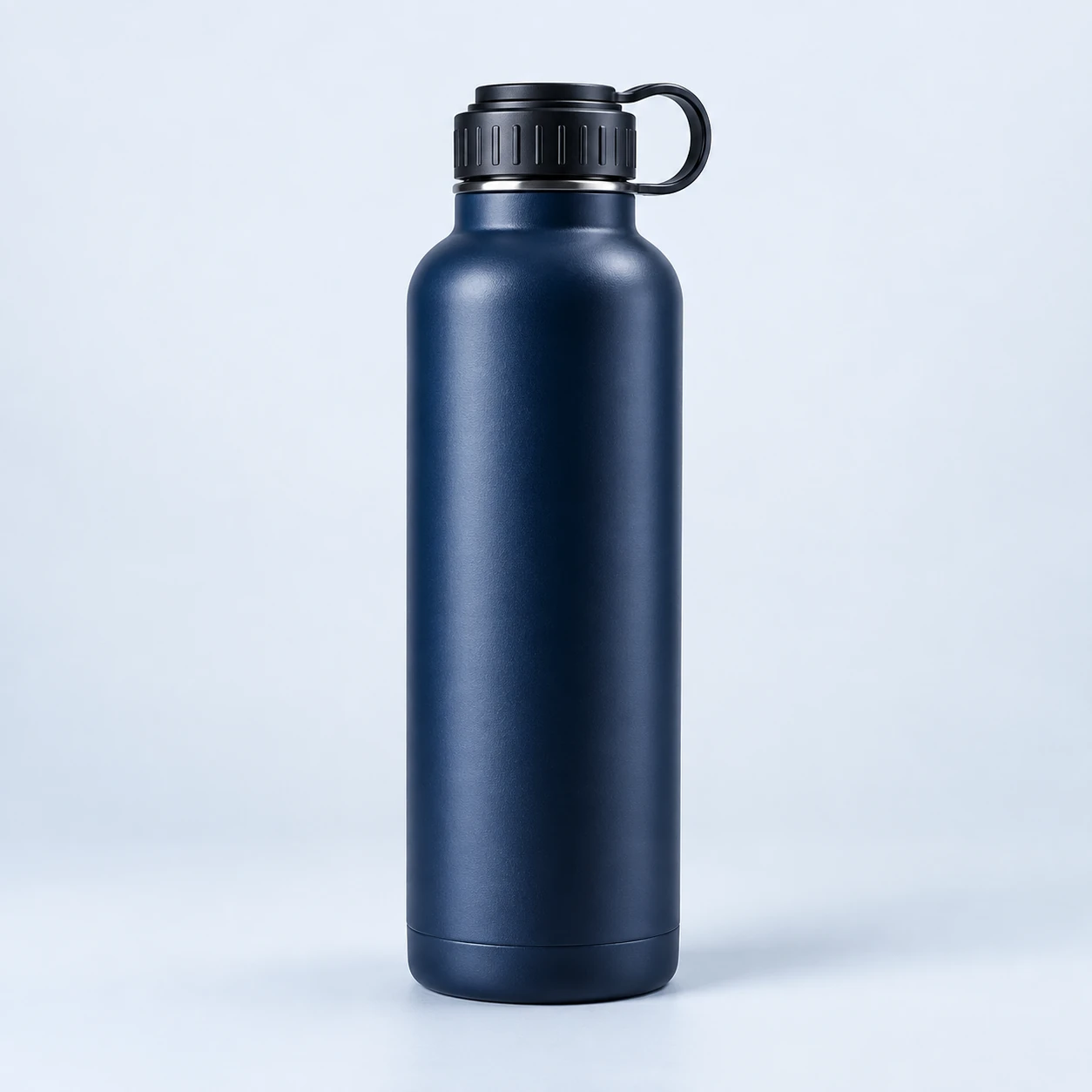 Matte navy stainless steel water bottle with a carry-loop cap